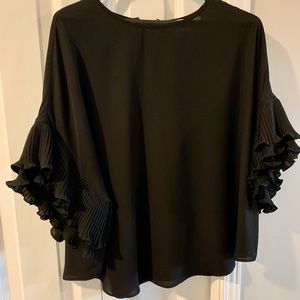 Blouse, Black and Sexy with a frill sleeve.